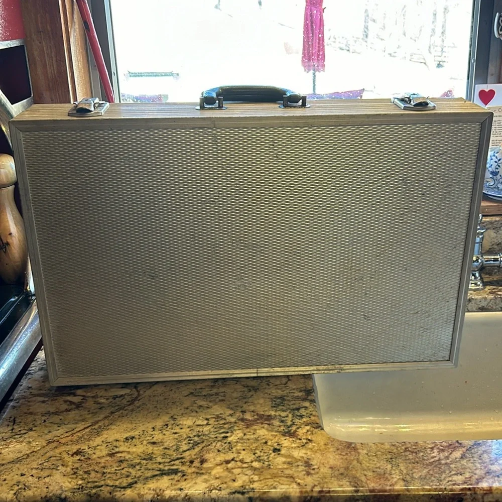 Aluminum padded case, handy for carrying anything; 24”long, 13.5”wide 4” deep